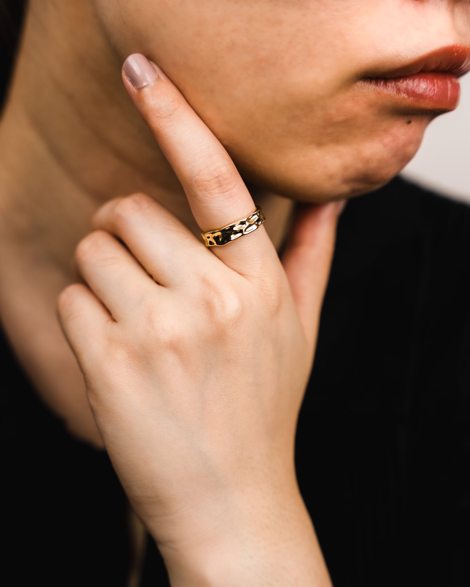 GOLD WREN RING ON FINGER